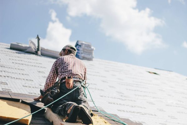 roofer-adding-shingles-to-the-roof