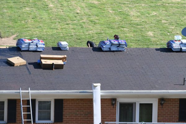 roofers-roofing-company-repairing-a-damaged-roof